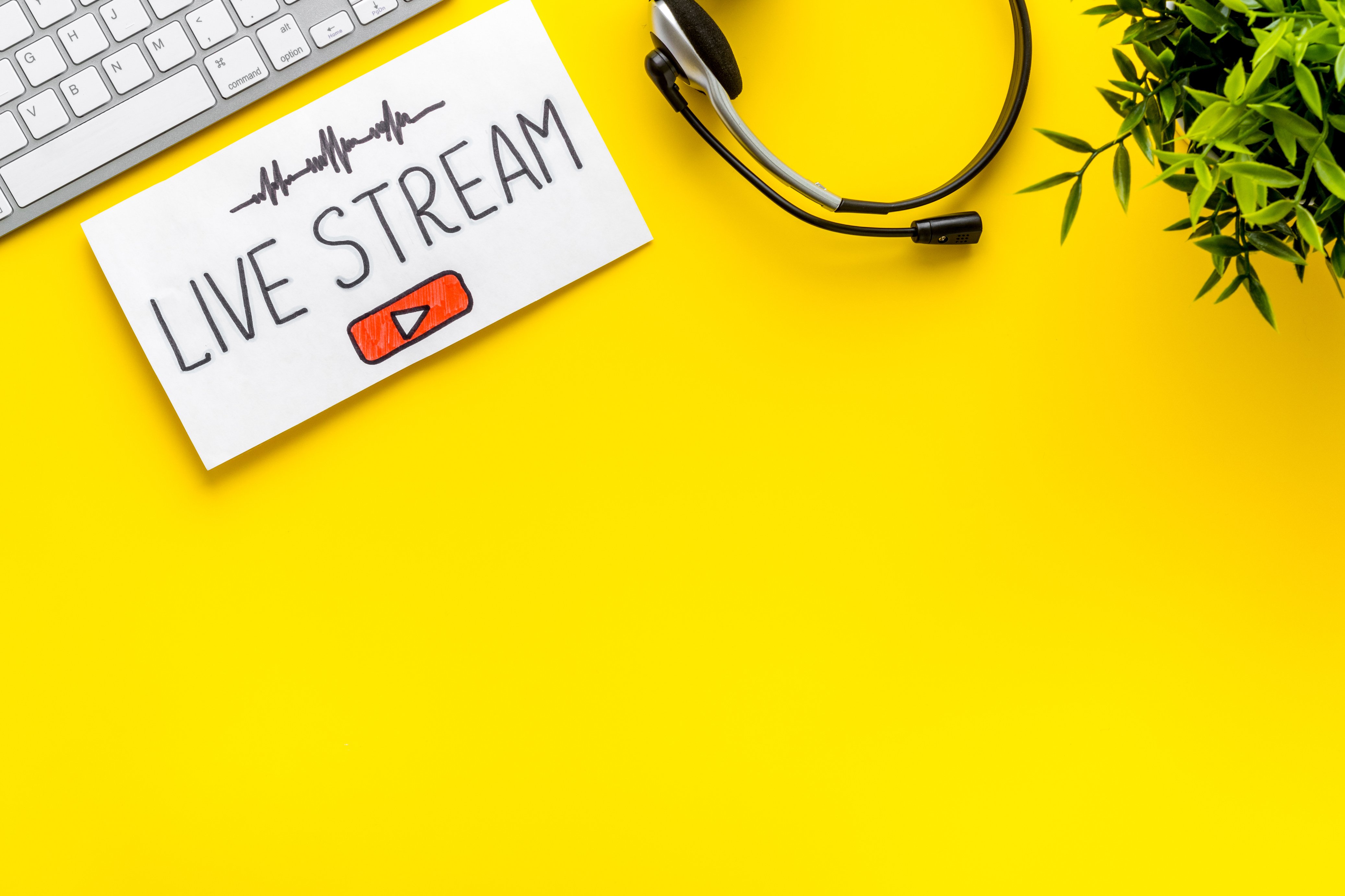 Online streaming social media concept. Paper tablet on office desk top view